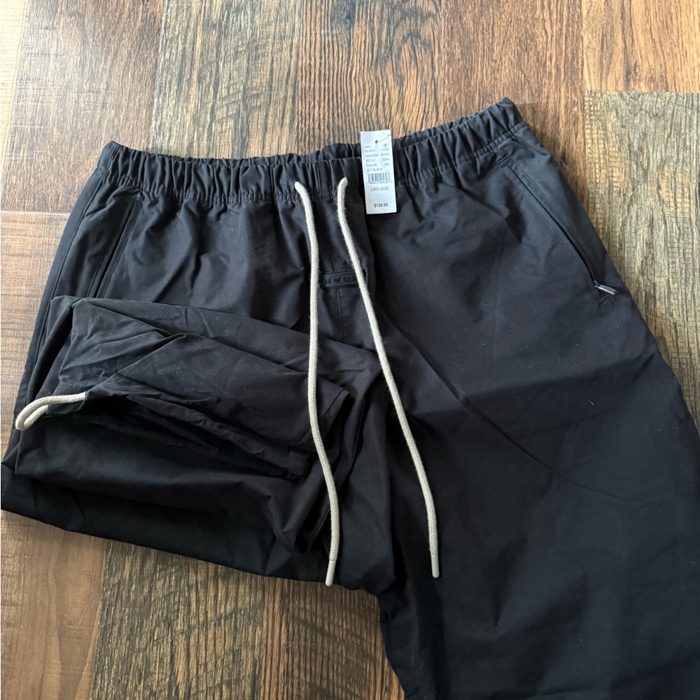 Fear of God Essentials Black Cargo Pants With Cream Drawstring